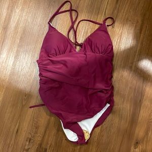 Brand new. Wine color, size large.